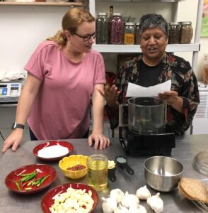 two women demonstrating cooking